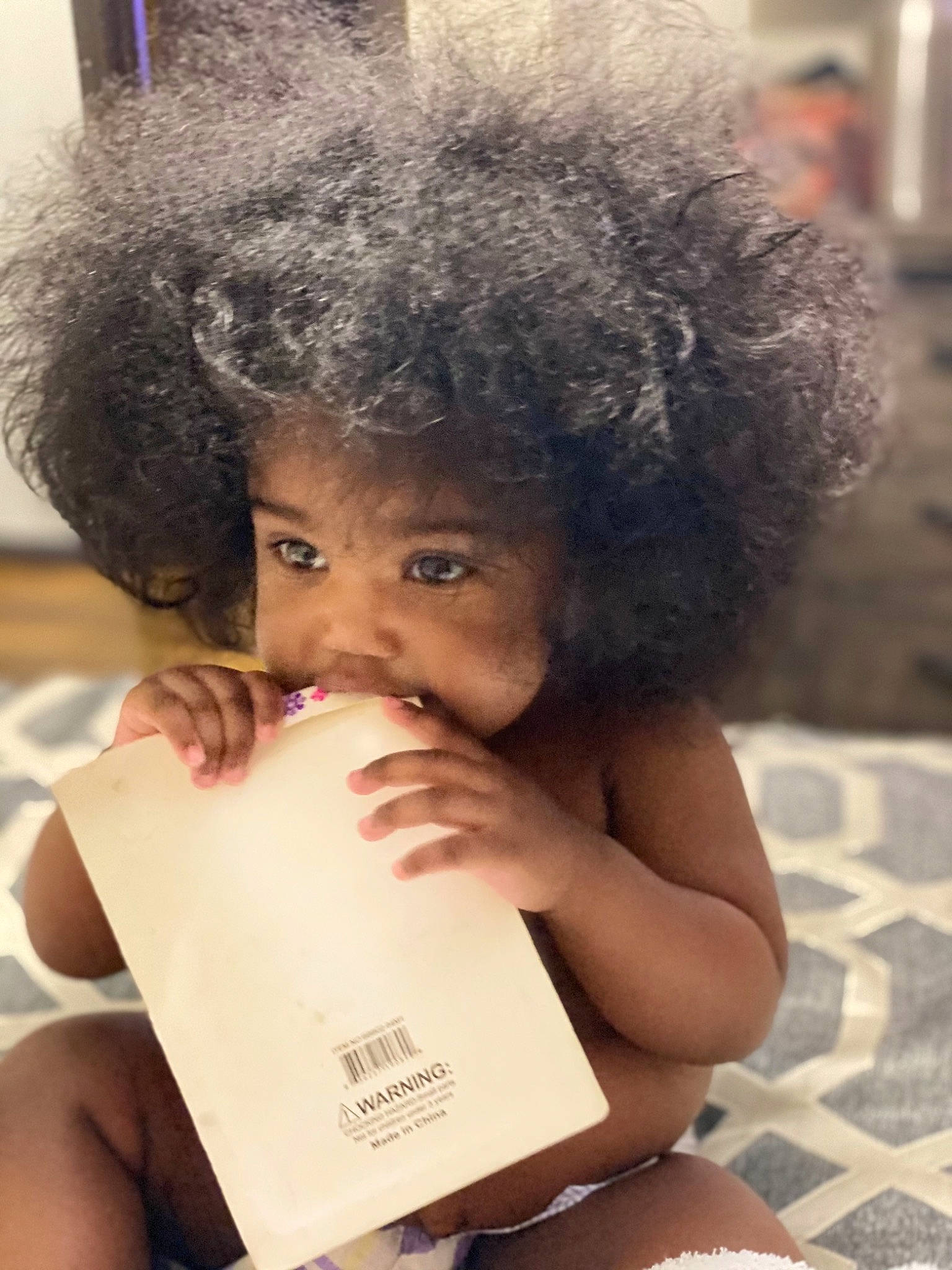 Janiya is registered to the contest to win money with this photo: afro, beauty, black, black_hair, child, eyebrow, eyelash, face, fur, hair, hairstyle, happy, human, nose, organ, people, person, sitting, skin, snapshot