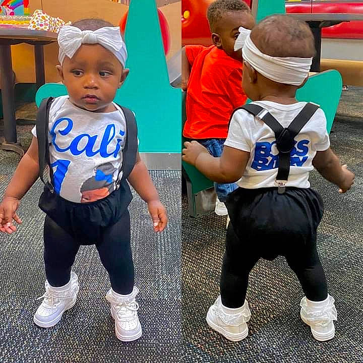 Cali joined the competition — help win amazing prizes! baby, child, clothing, footwear, headwear, outerwear, person, play, product, shoe, sportswear, t_shirt, toddler