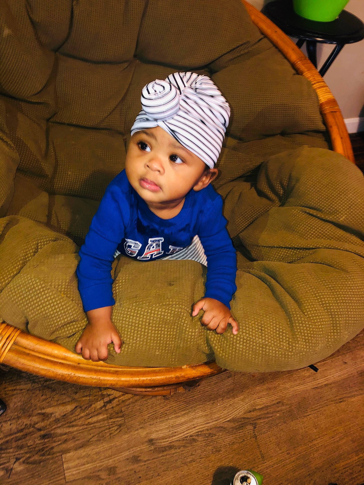 Katrina is registered to the contest to win money with this photo: baby, baby_toddler_clothing, beanie, boats_and_boating_equipment_and_supplies, cap, child, comfort, fashion_accessory, flooring, fun, headwear, knit_cap, leisure, linens, outerwear, person, play, sitting, sleeve, toddler