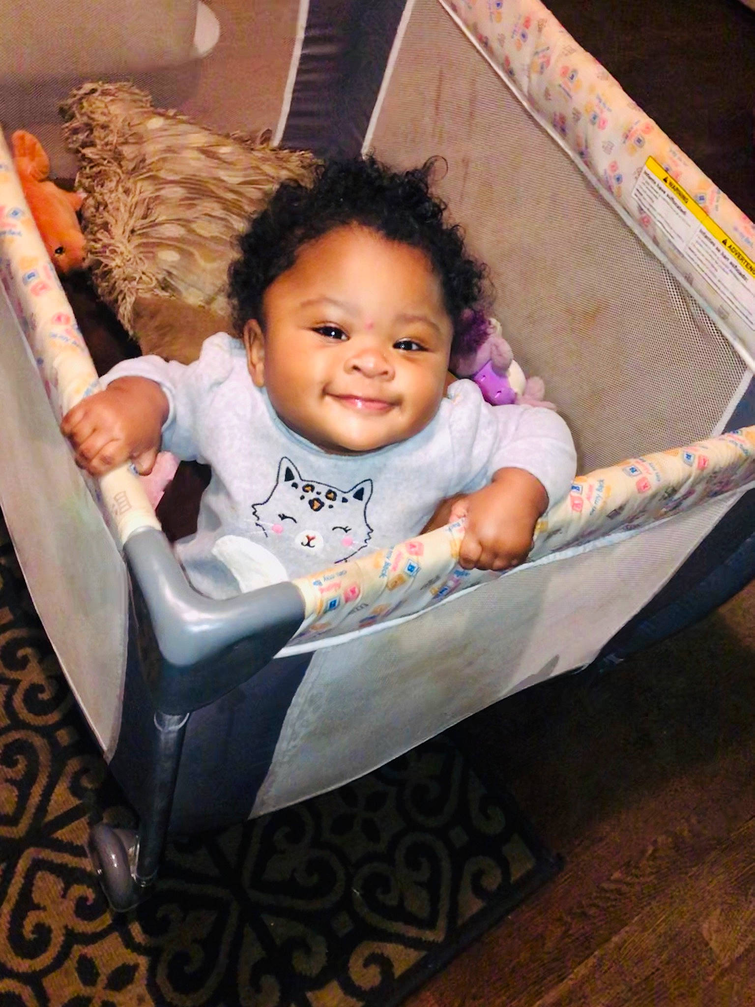 Katrina is registered to the contest to win money with this photo: baby, baby_carriage, baby_products, baby_toddler_clothing, cheek, child, comfort, dress, facial_expression, flash_photography, fun, happy, head, joy, leisure, mammal, person, product, skin, smile