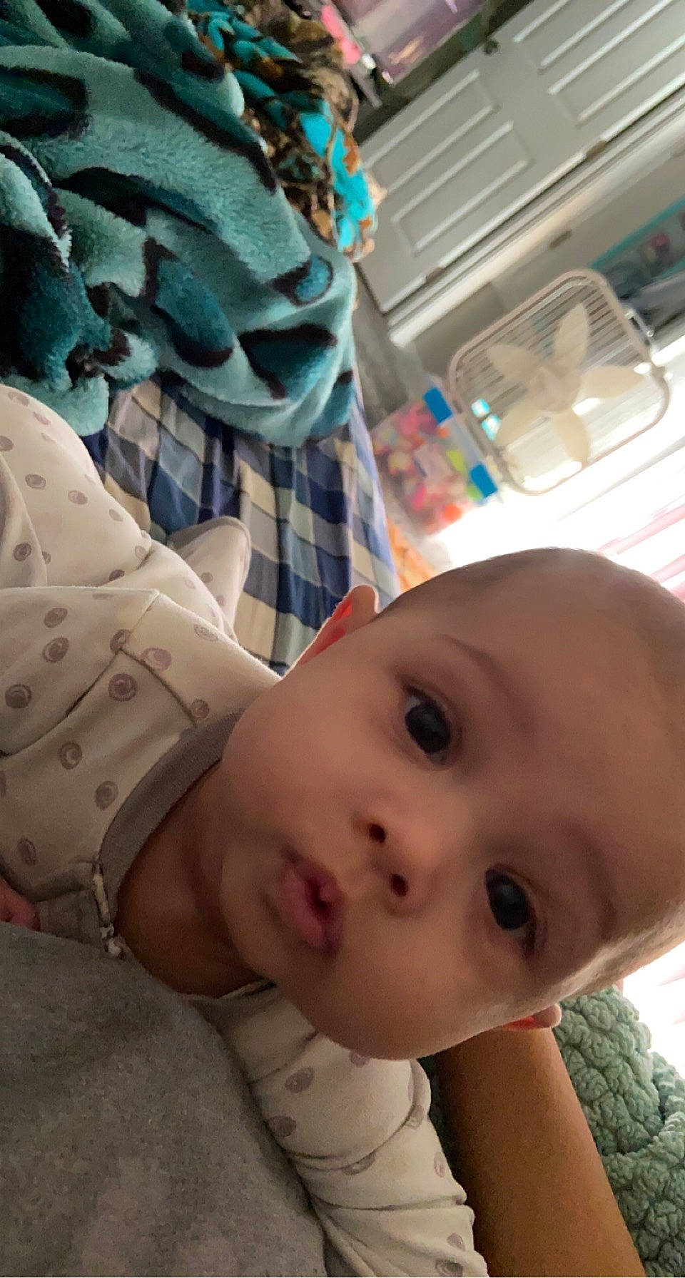 Mazikeen is registered to the contest to win money with this photo: baby, baby_safety, baby_toddler_clothing, beauty, cheek, child, comfort, cool, face, fun, happy, linens, mouth, nose, pattern, person, skin, sleeve, toddler, vacation