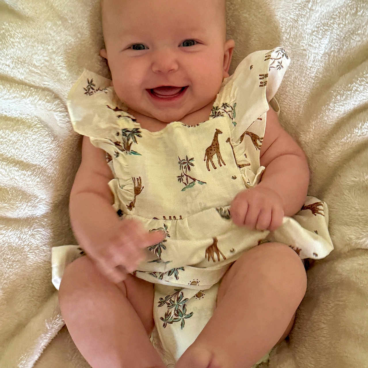 Evelynn is registered to the contest to win money with this photo: baby, babylaughing, bodypart, clothing, cushion, dress, face, finger, furniture, hand, happy, head, homedecor, laughing, newborn, person, photography, portrait, sitting, smile