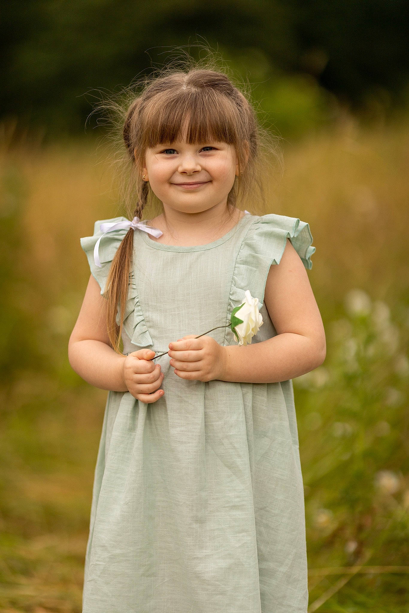 Emily joined the competition — help win amazing prizes! baby_toddler_clothing, blond, brown_hair, child, day_dress, dress, gesture, grass, grassland, happy, jewellery, joy, meadow, one_piece_garment, pattern, people_in_nature, person, plant, prairie, sleeve