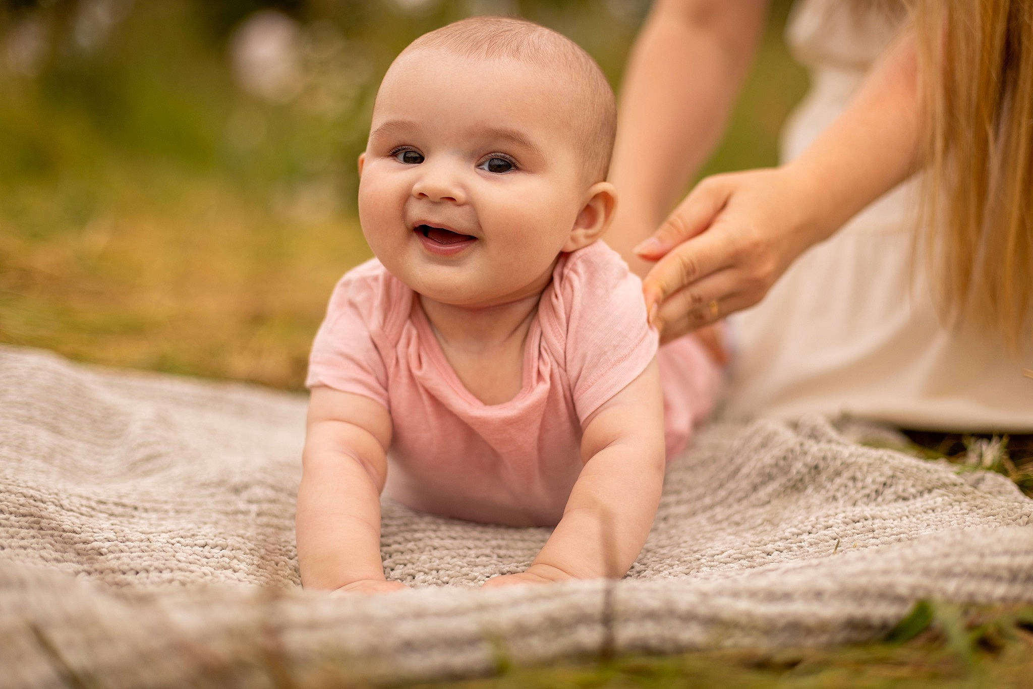 Zlata joined the competition — help win amazing prizes! arm, baby, baby_toddler_clothing, child, close_up, crawling, face, flooring, fun, gesture, grass, hand, happy, joy, leisure, people_in_nature, person, skin, smile, thumb