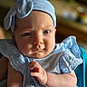 Skyler is registered to the contest to win money with this photo: baby, infant, child, blue_headband, blue_dress, face, hand, skin, portrait, cute, expression, indoor, soft_light, closeup, person, newborn, clothing, fashion, infant_fashion, headwear