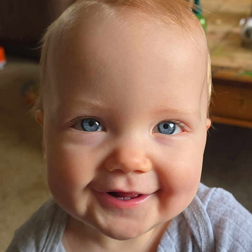 Skyler joined the competition — help win amazing prizes! baby, blue_eyes, smiling, close_up, face, infant, child, portrait, indoor, cozy, cute, happy, skin, young_child, apparel, head, person, human, expression, blond_hair