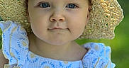 Skyler is registered to the contest to win money with this photo: baby, blue_eyes, child, cute, dress, face, fashion, greenery, hat, infant, nature, outdoor, person, portrait, ruffles, smile, straw_hat, summer, sunlight, young