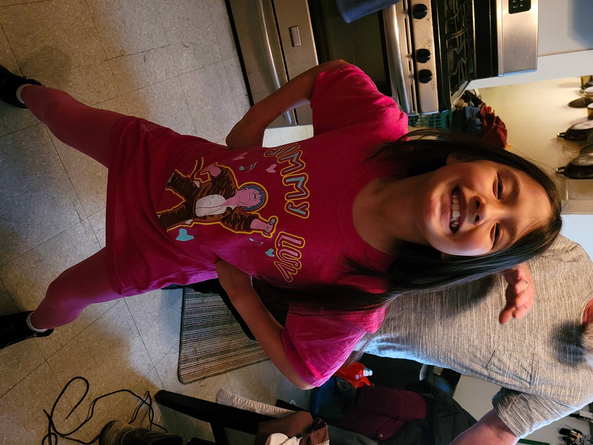 Heather is registered to the contest to win money with this photo: carmine, elbow, eyewear, fashion_design, flooring, fun, happy, human_leg, joy, lamp, magenta, mouth, person, picture_frame, pink, room, shoulder, sleeve, smile, t_shirt