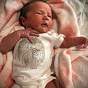 Callie joined the competition — help win amazing prizes! newborn, baby, infant, blanket, onesie, clothing, face, hand, cute, soft, pink, white, portrait, lying_down, skin, expression, indoors, fabric, person, newborn_baby