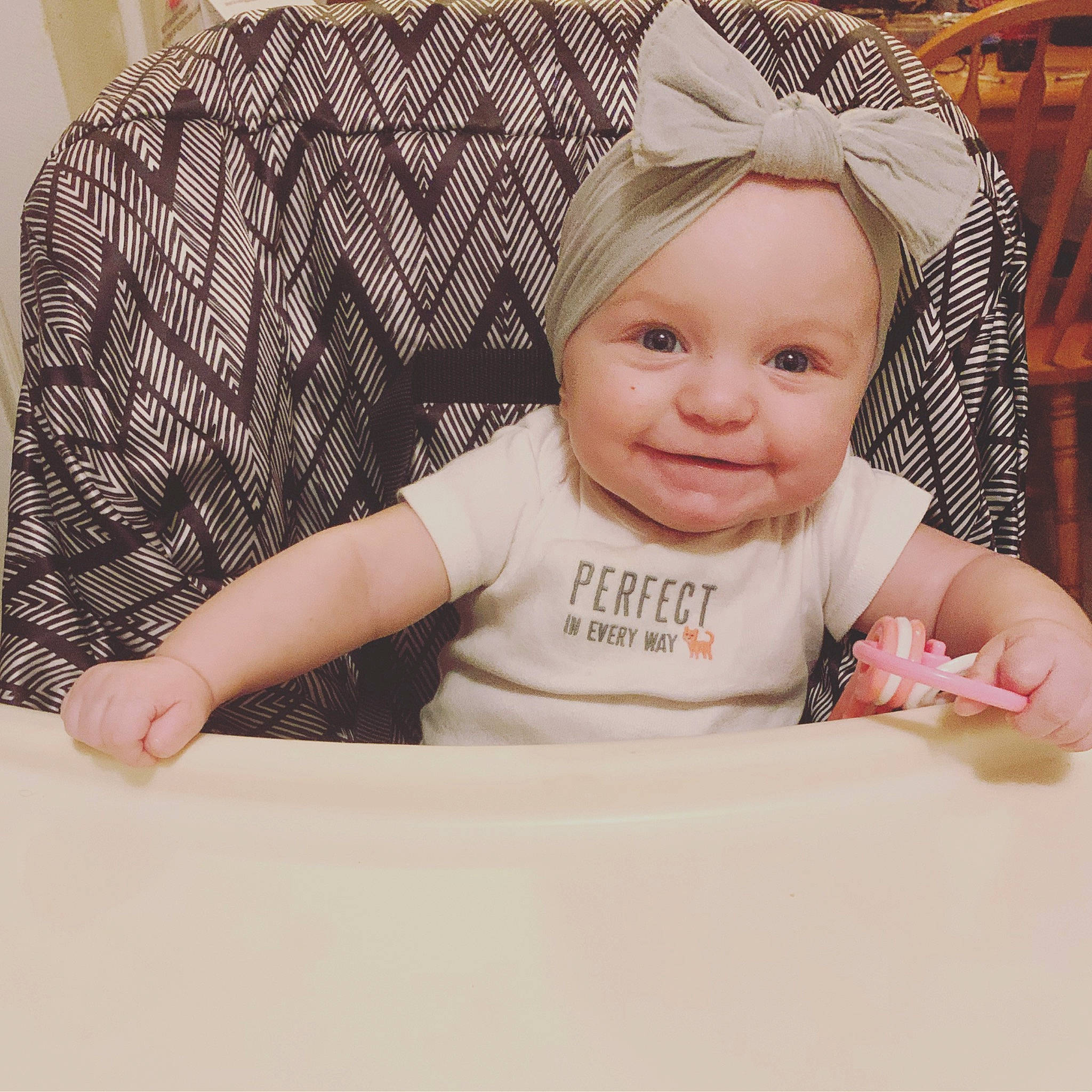 Karmen is registered to the contest to win money with this photo: baby, baby_laughing, baby_products, baby_toddler_clothing, cheek, child, comfort, fashion_accessory, happy, joy, laugh, linens, pattern, person, plaid, product, room, sitting, skin, sleeve