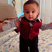 Priyansh Minhas joined the competition — help win amazing prizes! baby, child, indoor, bed, bedroom, curtains, window, clothing, vest, pants, patterned_quilt, hand, person, supporting, face, standing, door, decor, fabric, sleeping_area