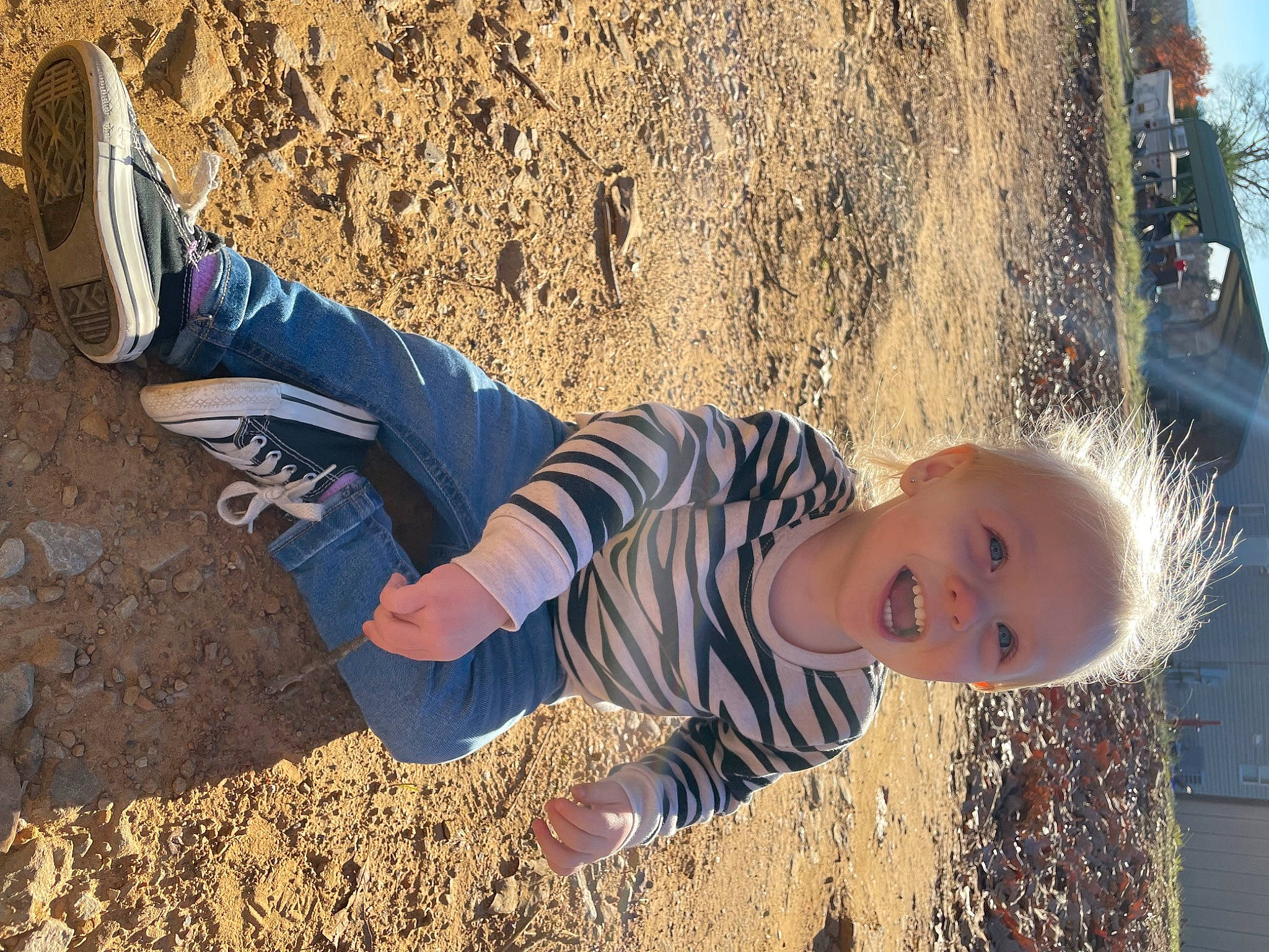Tonya joined the competition — help win amazing prizes! electric_blue, foot, fun, grass, happy, human_leg, landscape, leg, leisure, people_in_nature, person, sand, shadow, sitting, smile, sneakers, soil, summer, toddler, tree