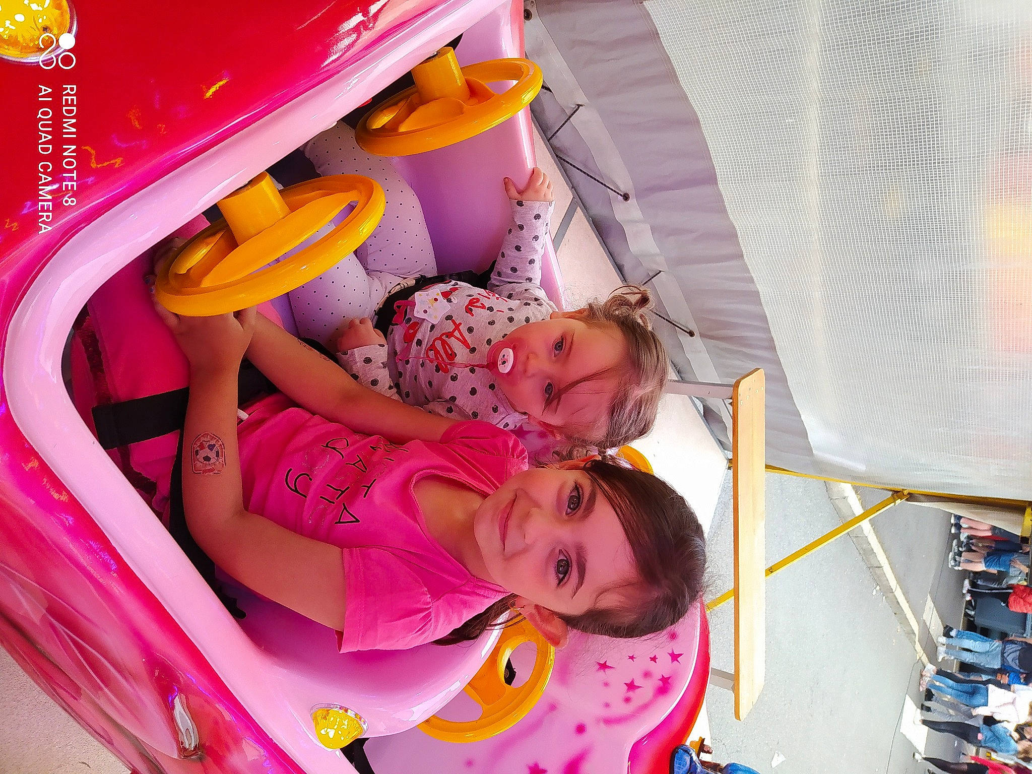 Sophia participe au concours pour gagner de l'argent avec cette photo : baby, child, comfort, fun, happy, joy, leisure, magenta, orange, pattern, person, pink, play, product, red, room, smile, textile, toddler, wheel