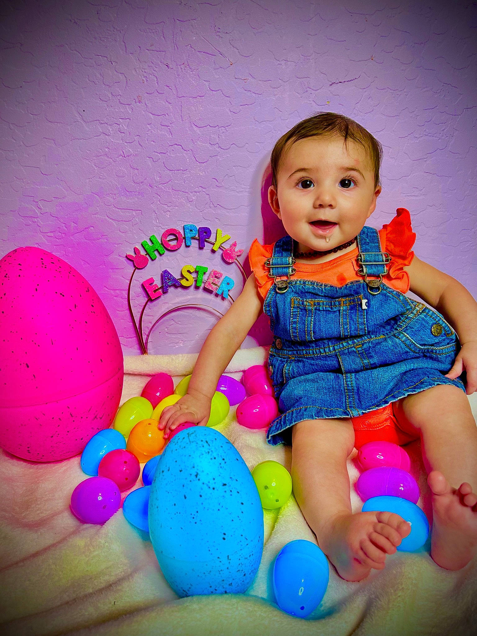 Maddison is registered to the contest to win money with this photo: baby, baby_playing_with_toys, baby_toddler_clothing, balloon, child, electric_blue, facial_expression, flash_photography, fun, happy, human_leg, leisure, magenta, party_supply, person, pink, play, purple, sitting, toddler
