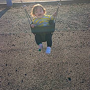 Zachary joined the competition — help win amazing prizes! child, toddler, swing, playground, sunlight, park, outdoor, grass, picnic_shelter, fence, happy, baby, clothing, footwear, mismatched_socks, chain, seat, daytime, smile, curly_hair