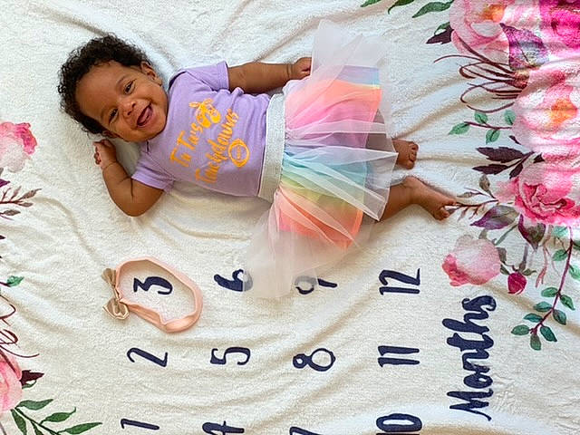 Rilee is registered to the contest to win money with this photo: baby, baby_products, baby_sleeping, baby_toddler_clothing, bedtime, blanket, child, hand, happy, joy, linens, love, nap, pattern, person, photography, pink, play, product, sleep