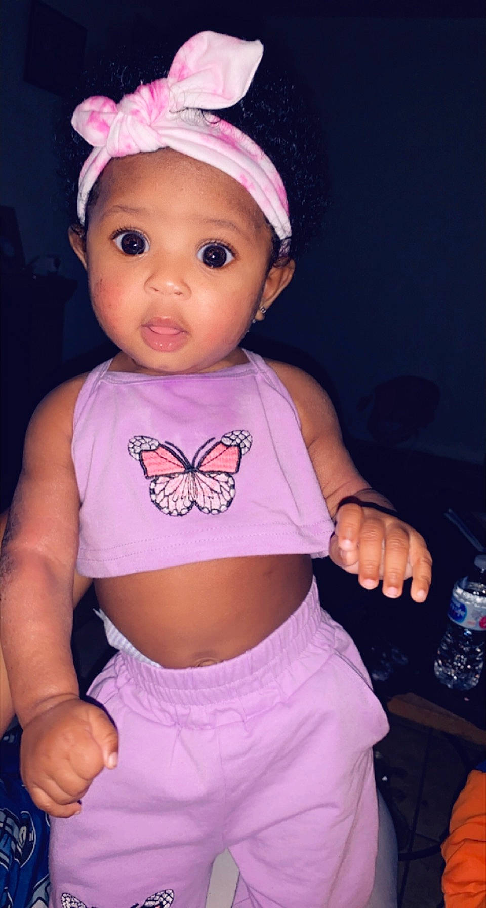 Laiyani is registered to the contest to win money with this photo: baby_toddler_clothing, cheek, clothing, eye, face, facial_expression, hair, hairstyle, head, headwear, human_body, leg, lip, neck, person, purple, shorts, skin, sleeve, stomach
