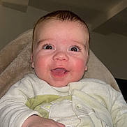 Thélio participe au concours pour gagner de l'argent avec cette photo : baby, smiling, face, hand, pajamas, blanket, indoor, child, happy, cute, infant, portrait, cozy, clothing, skin, person, young, warm, expression, closeup