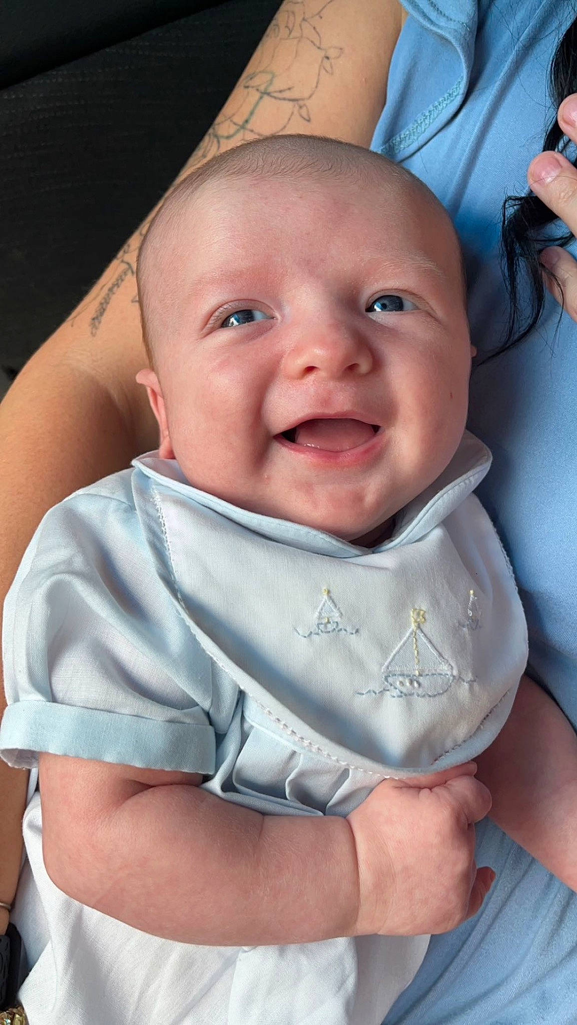 Kooper is registered to the contest to win money with this photo: baby, baby_toddler_clothing, blue, cheek, child, chin, comfort, eye, finger, gesture, hand, happy, iris, lip, mouth, nose, person, skin, sleeve, smile