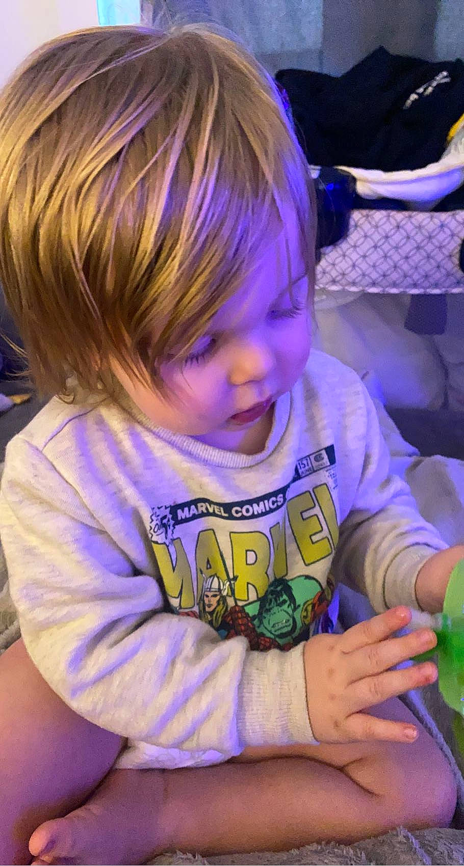 Jaxon is registered to the contest to win money with this photo: baby_toddler_clothing, bangs, chair, cheek, child, comfort_food, electric_blue, fun, happy, iris, magenta, party, person, play, purple, recreation, sitting, smile, t_shirt, toddler