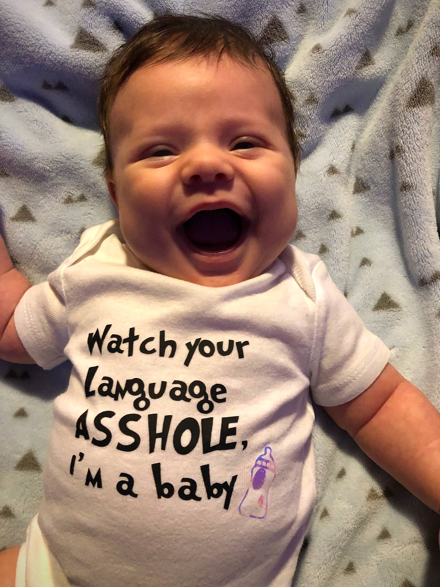 Mathew is registered to the contest to win money with this photo: baby, baby_toddler_clothing, cheek, chin, comfort, face, facial_expression, gesture, happy, head, mammal, mouth, neck, nose, organ, person, skin, sleeve, smile, toddler