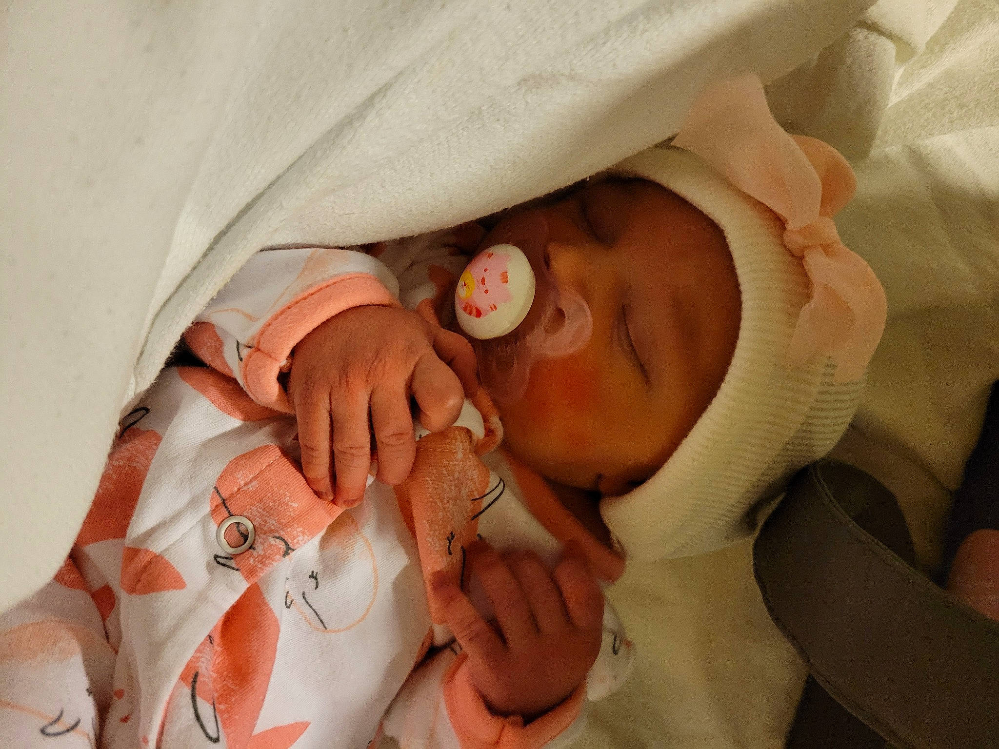 Allyson is registered to the contest to win money with this photo: arm, baby, baby_products, baby_toddler_clothing, child, comfort, event, eyelash, finger, gesture, hand, headwear, mammal, mouth, nail, person, product, skin, textile, thumb