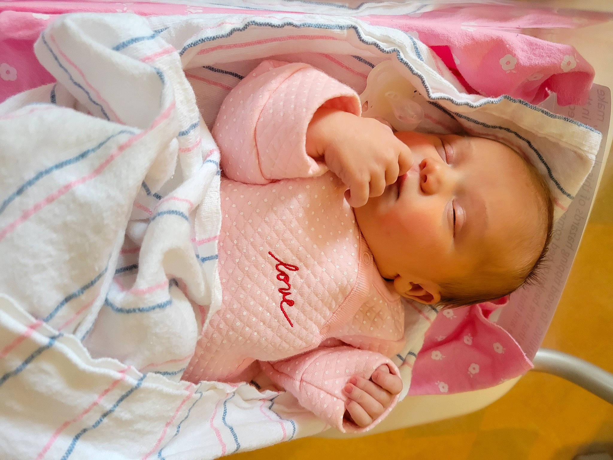 Allyson is registered to the contest to win money with this photo: baby, baby_products, baby_sleeping, baby_toddler_clothing, bedding, bedtime, cheek, child, childbirth, comfort, eye, face, facial_expression, linens, mouth, person, pink, room, skin, sleeve