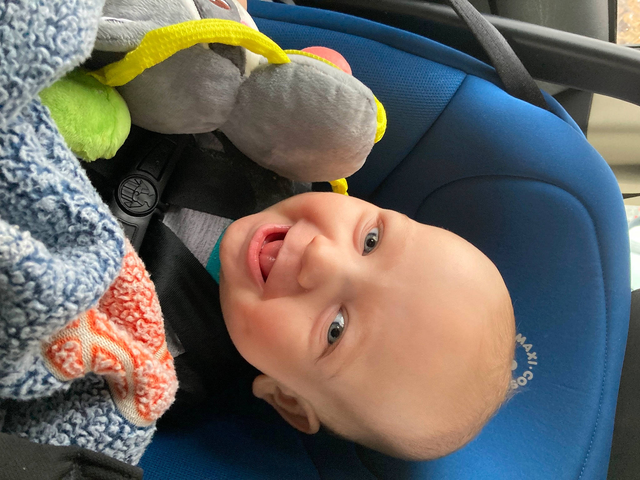 Beau is registered to the contest to win money with this photo: automotive_design, baby, baby_products, baby_toddler_clothing, car_seat, child, comfort, family_car, fun, happy, headgear, motor_vehicle, nose, person, skin, smile, stuffed_toy, toddler, toy, vehicle_door