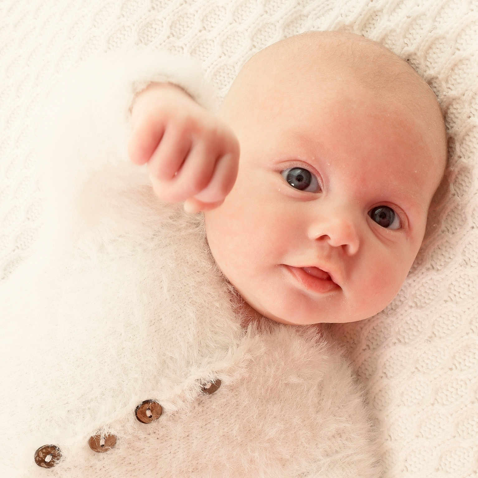 Jacob is registered to the contest to win money with this photo: accessories, baby, blanket, bodypart, face, finger, hand, happy, head, jewelry, mouth, necklace, newborn, person, photography, portrait, smile
