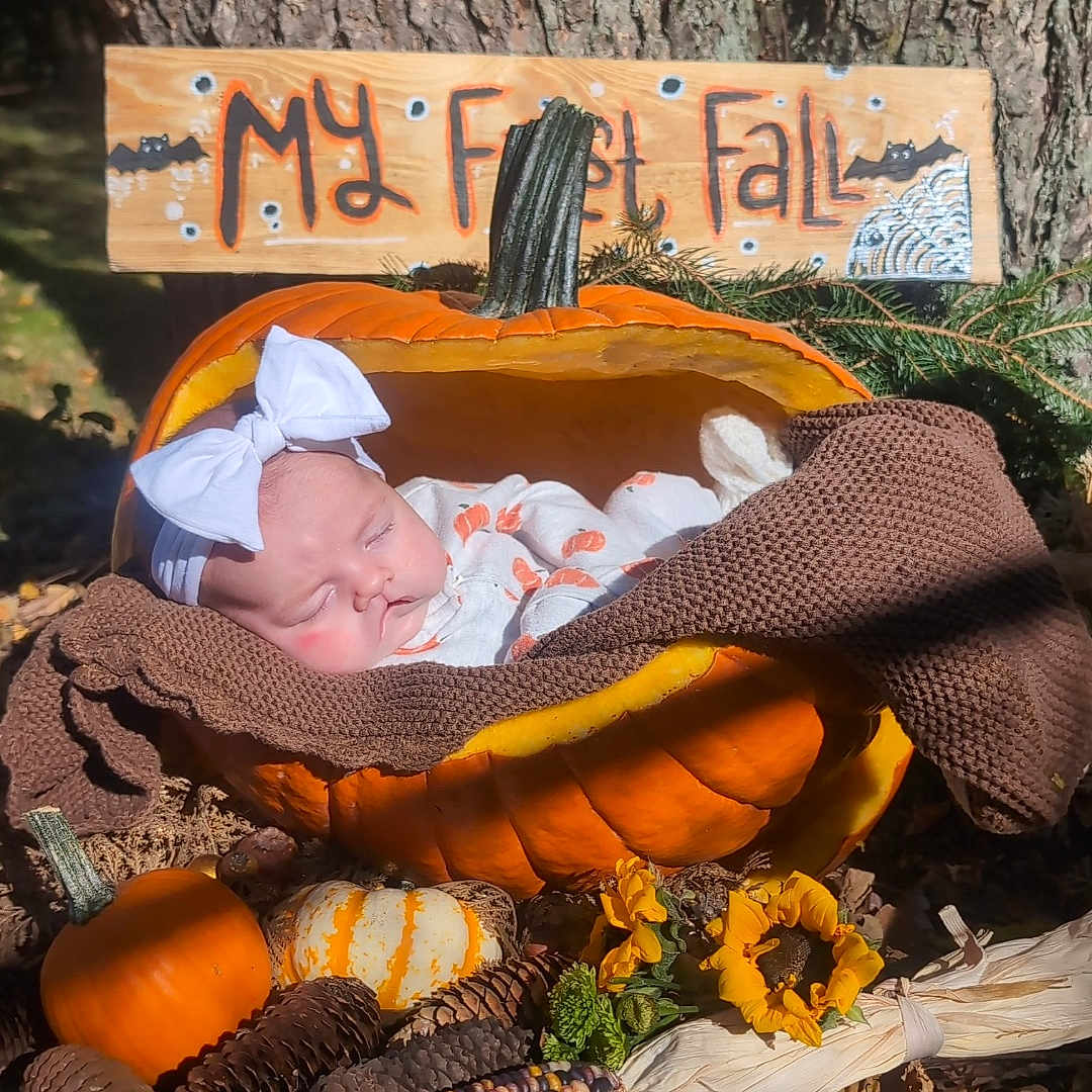 Rosemary joined the competition — help win amazing prizes! baby, blanket, clothing, couch, face, food, furniture, hat, head, newborn, person, photography, plant, portrait, produce, pumpkin, sleeping, squash, tree, vegetable