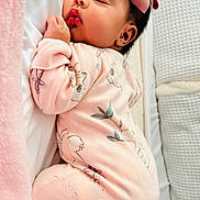 Ariella joined the competition — help win amazing prizes! baby, sleeping, pink_onesie, bow, infant, blanket, cozy, soft, cute, animal_print, newborn, child, face, peaceful, resting, indoor, portrait, closeup, toddler, sleep