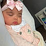Ariella joined the competition — help win amazing prizes! baby, sleeping, pink_bow, headband, blanket, infant, sleep, soft_lighting, indoors, cute, peaceful, child, cozy, knit_blanket, pastel_colors, portrait, hand, face, clothing, bedroom