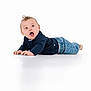 Jackson joined the competition — help win amazing prizes! baby, child, infant, blue_eyes, curly_hair, navy_sweater, denim_jeans, lying_down, white_background, cute, expression, open_mouth, hands, feet, studio_photo, portrait, casual_clothing, young_child, isolated, healthy