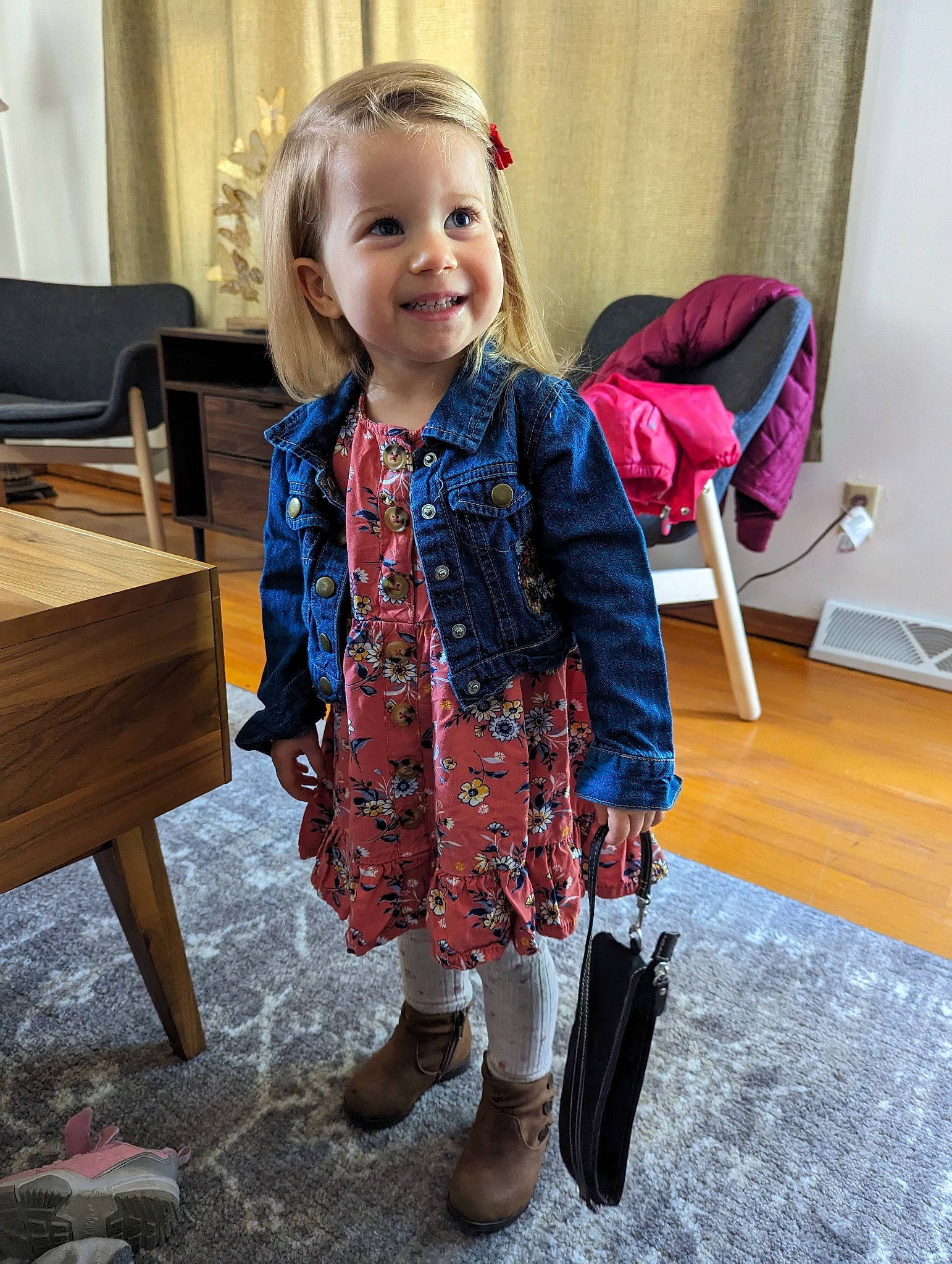 Maya joined the competition — help win amazing prizes! baby, baby_toddler_clothing, bag, blond, chair, child, curtain, dress, electric_blue, face, flooring, furniture, happy, joint, joy, luggage_and_bags, person, sleeve, smile, standing