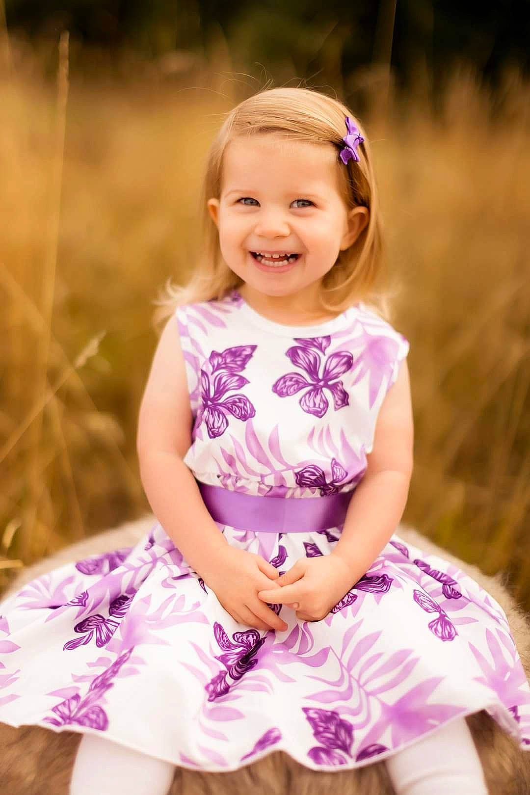Maya joined the competition — help win amazing prizes! baby_toddler_clothing, beauty, blond, child, day_dress, dress, flash_photography, fun, grass, happy, joy, magenta, people_in_nature, person, pink, plant, purple, skin, sleeve, smile