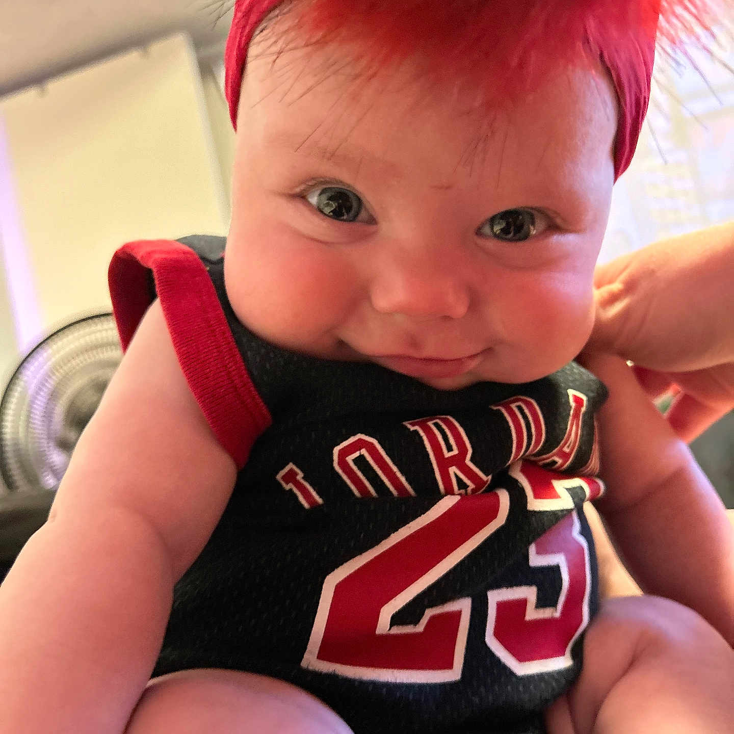 Zariyah is registered to the contest to win money with this photo: baby, bodypart, clothing, costume, face, finger, hair, hand, happy, head, laughing, mouth, pants, person, photography, portrait, shorts, smile, t_shirt, teeth