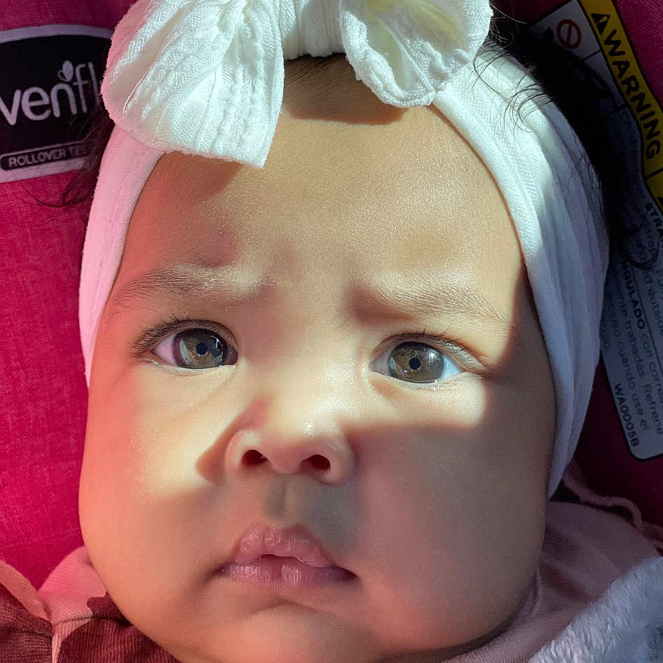 Raelynn is registered to the contest to win money with this photo: baby, baby_toddler_clothing, beauty, bonnet, cap, cheek, child, ear, eyelash, fashion_accessory, hair_accessory, happy, headband, headgear, headpiece, lip, pink, portrait_photography, snapshot, toddler