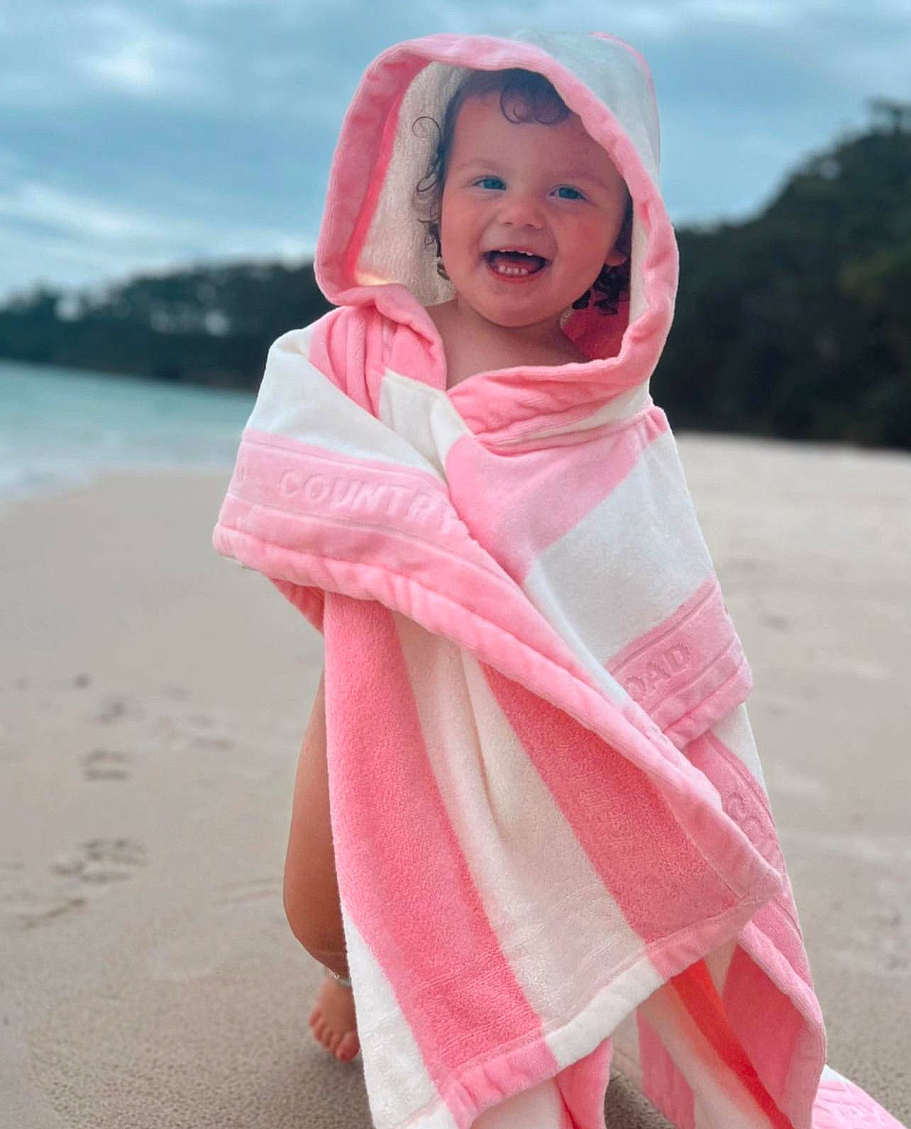 Hallie joined the competition — help win amazing prizes! beauty, child, cloud, dress, fashion_accessory, fun, happy, headwear, jacket, joy, landscape, leisure, magenta, outerwear, person, pink, recreation, sand, sky, sleeve