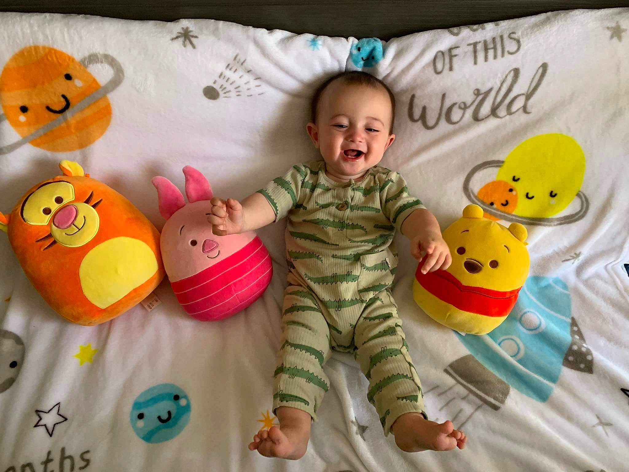 Remington is registered to the contest to win money with this photo: baby, baby_products, baby_toddler_clothing, child, comfort, facial_expression, fun, happy, linens, orange, person, product, skin, sleeve, smile, stuffed_toy, teddy_bear, textile, toddler, toy