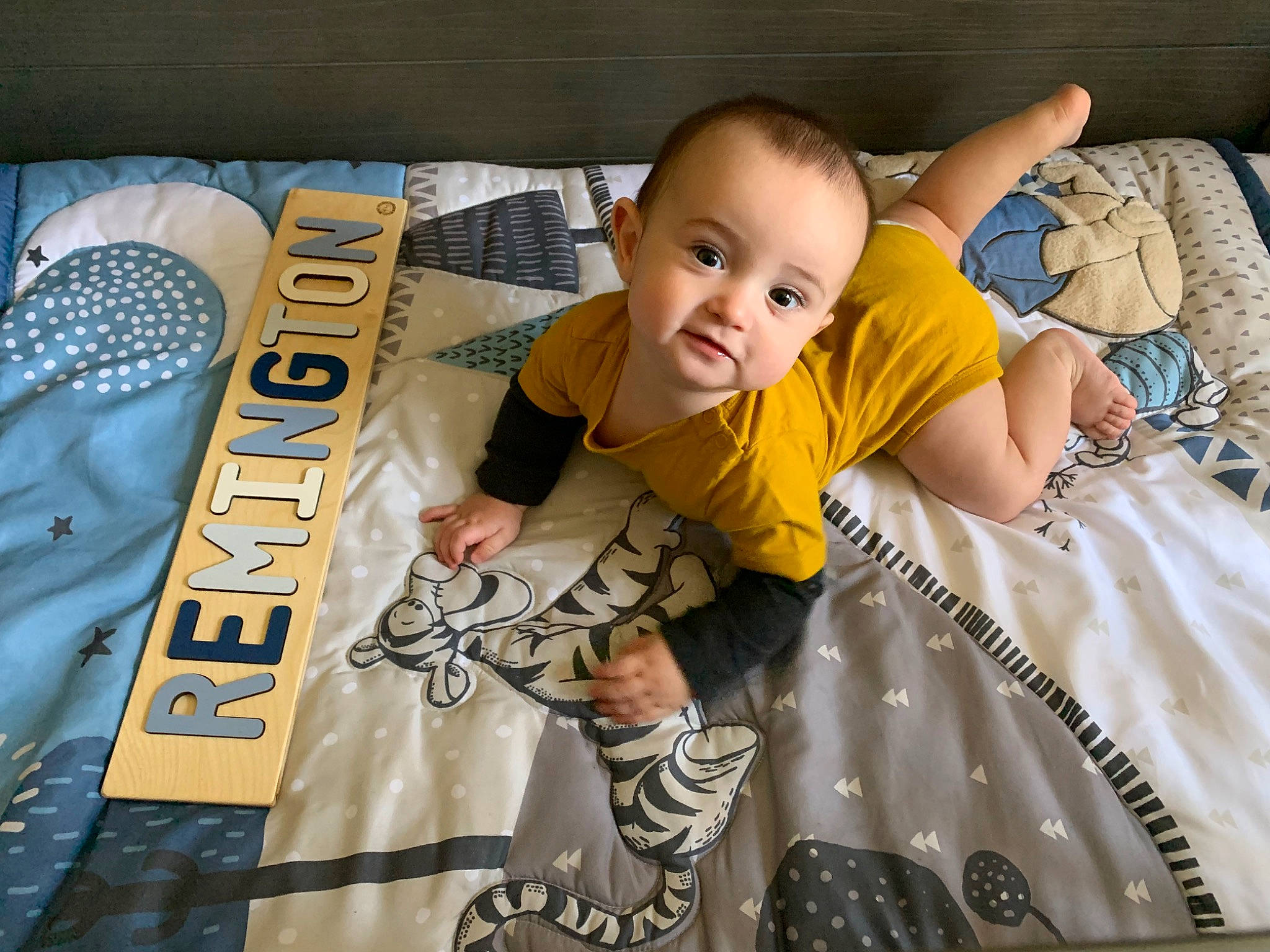 Remington joined the competition — help win amazing prizes! art, baby, baby_products, baby_toddler_clothing, comfort, cool, couch, flooring, fun, happy, linens, pattern, person, publication, room, sitting, sleeve, smile, t_shirt, throw_pillow