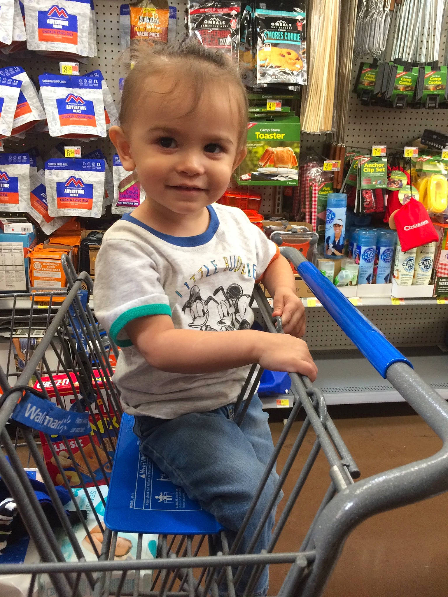 Landon is registered to the contest to win money with this photo: child, customer, fun, human_settlement, joy, leisure, person, photograph, product, public_space, retail, service, shelf, shopping, shopping_cart, smile, snapshot, standing, t_shirt, toddler