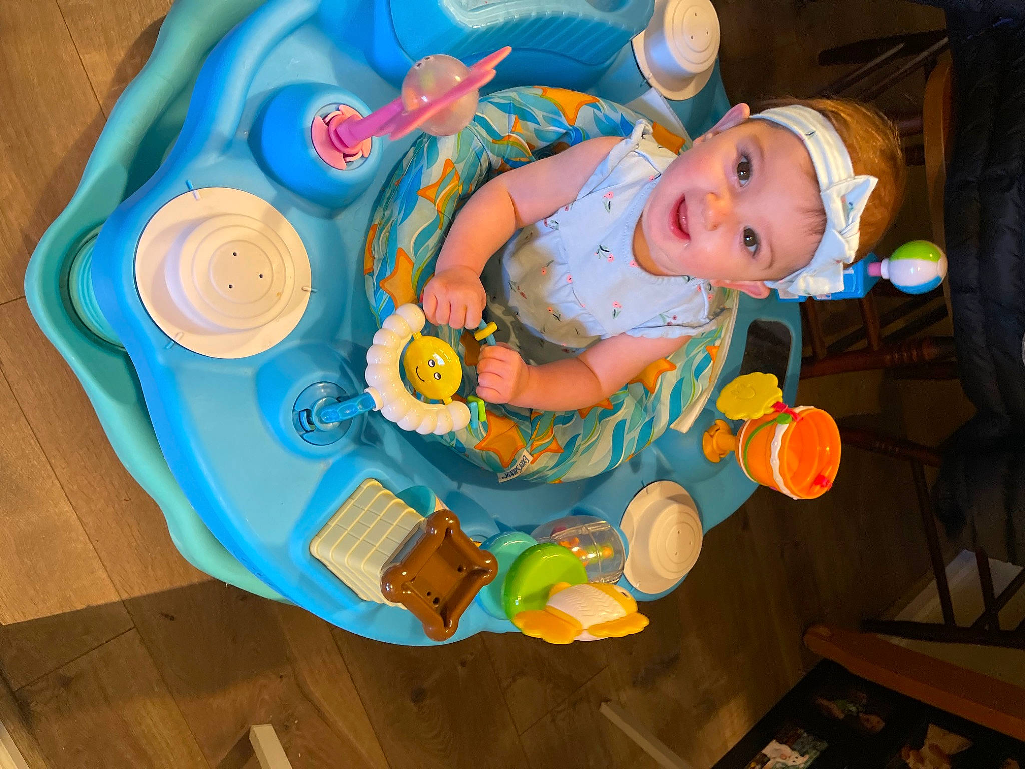 Zoë joined the competition — help win amazing prizes! baby, baby_products, baby_safety, baby_toddler_clothing, baby_toys, blue, child, circle, dishware, fictional_character, flooring, fun, hardwood, headwear, orange, pattern, person, plastic, play, room