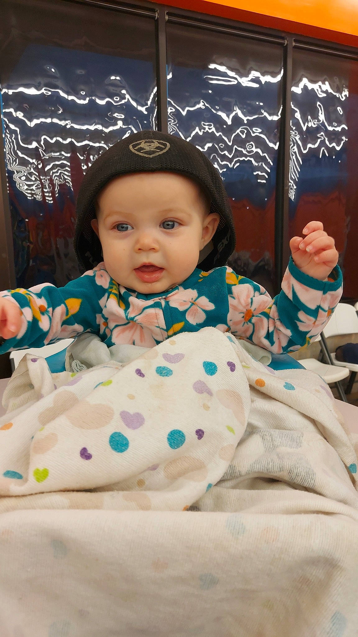 Dolly is registered to the contest to win money with this photo: baby, baby_toddler_clothing, baby_toys, cheek, child, comfort, fun, happy, headwear, leisure, linens, pattern, person, play, portrait_photography, product, room, sitting, skin, sleeve