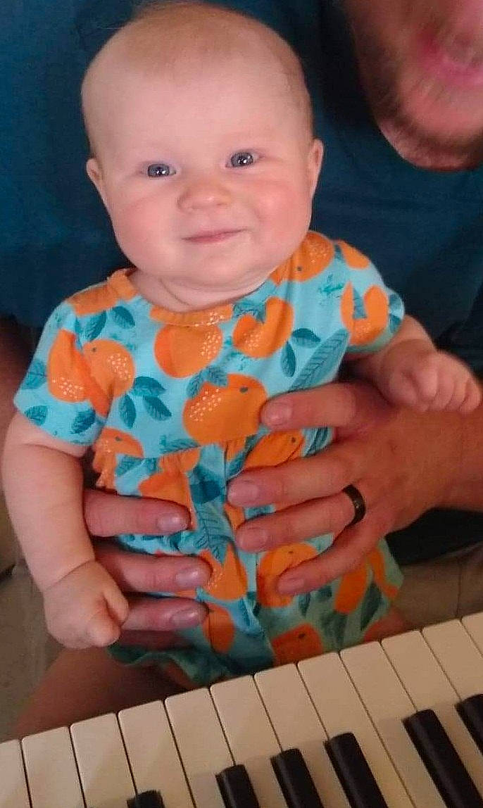 Payton joined the competition — help win amazing prizes! baby_toddler_clothing, blue, cheek, electronic_musical_instrument, face, finger, gesture, green, hand, happy, iris, joy, keyboard, musical_instrument, musical_keyboard, organ, person, piano, skin, sleeve