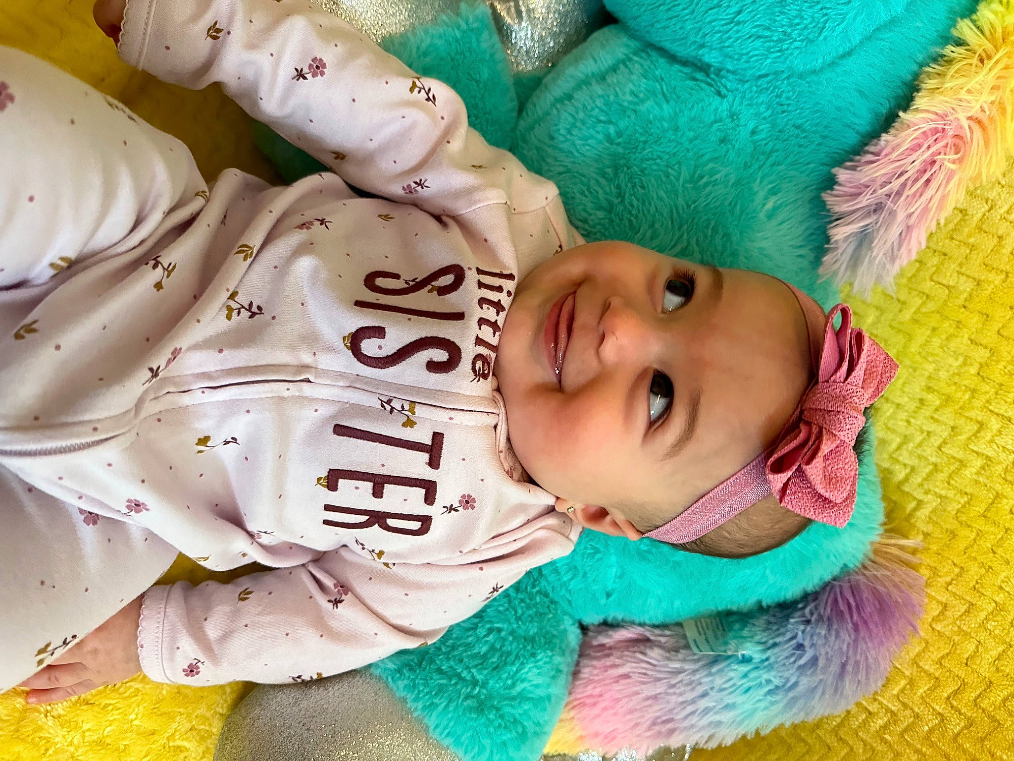 Mia is registered to the contest to win money with this photo: baby, baby_products, baby_toddler_clothing, beanie, cheek, child, fashion_accessory, fun, fur, happy, headwear, joy, laugh, leisure, magenta, person, pink, play, product, skin