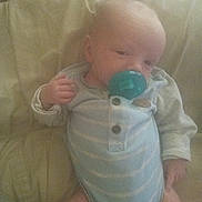 Braun joined the competition — help win amazing prizes! baby, infant, pacifier, couch, onesie, clothing, child, indoor, cute, young, person, relaxing, sitting, soft, furniture, portrait, sleepy, comfort, small, hand