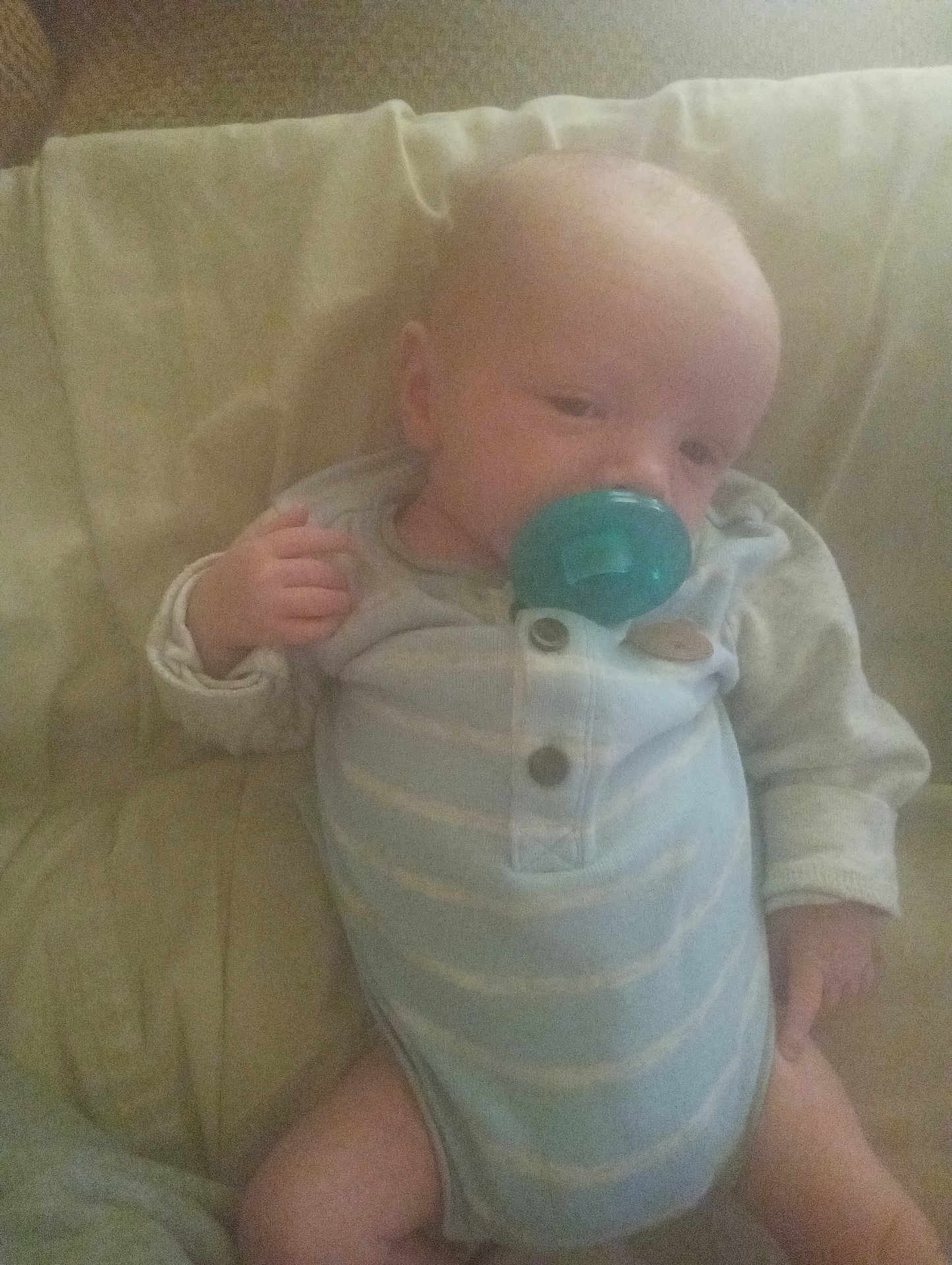 Braun joined the competition — help win amazing prizes! baby, infant, pacifier, couch, onesie, clothing, child, indoor, cute, young, person, relaxing, sitting, soft, furniture, portrait, sleepy, comfort, small, hand