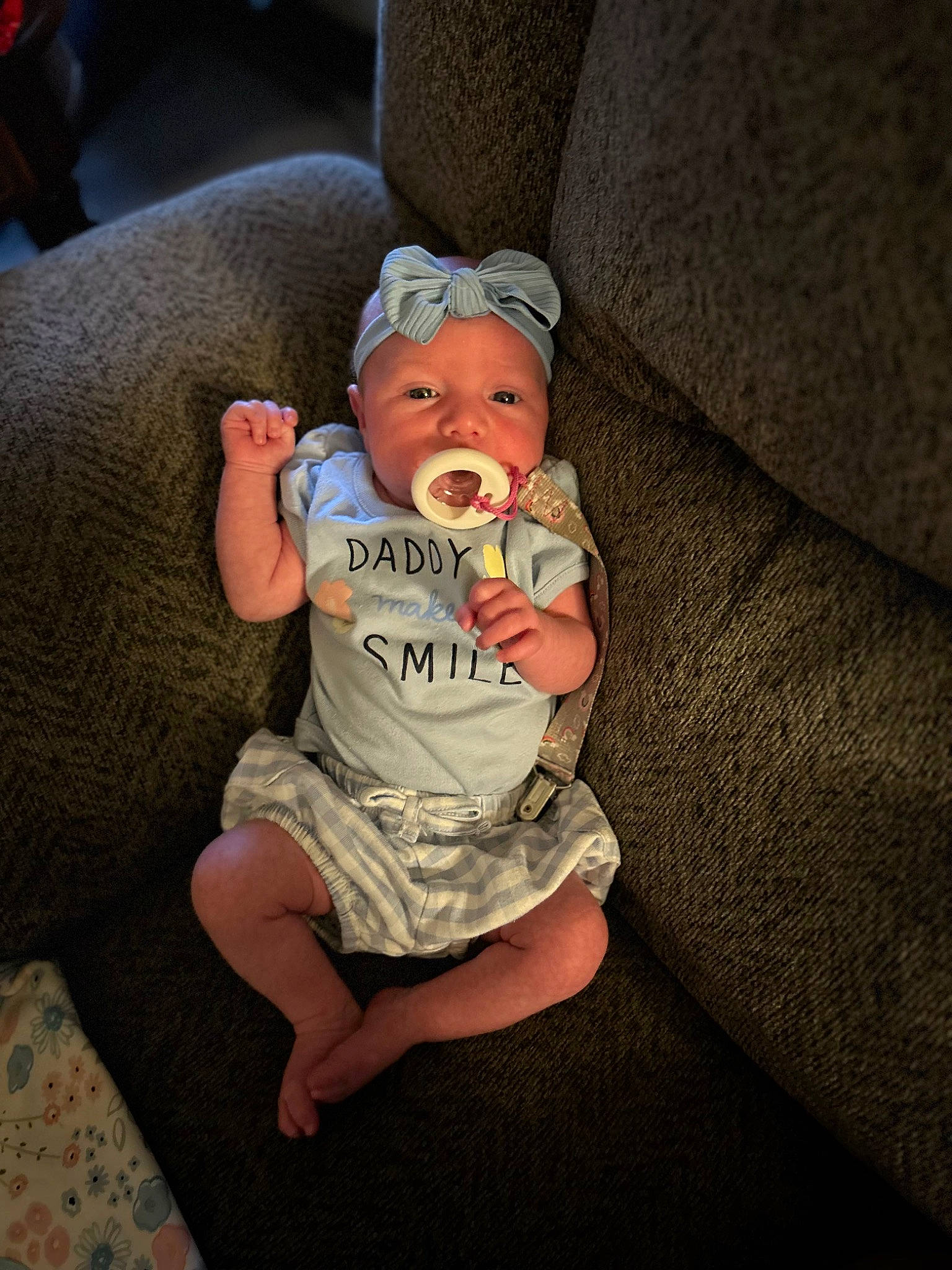 Syreece joined the competition — help win amazing prizes! baby, baby_toddler_clothing, child, comfort, couch, finger, flooring, foot, fun, hat, headwear, human_body, human_leg, lap, leg, linens, mouth, person, sitting, skin