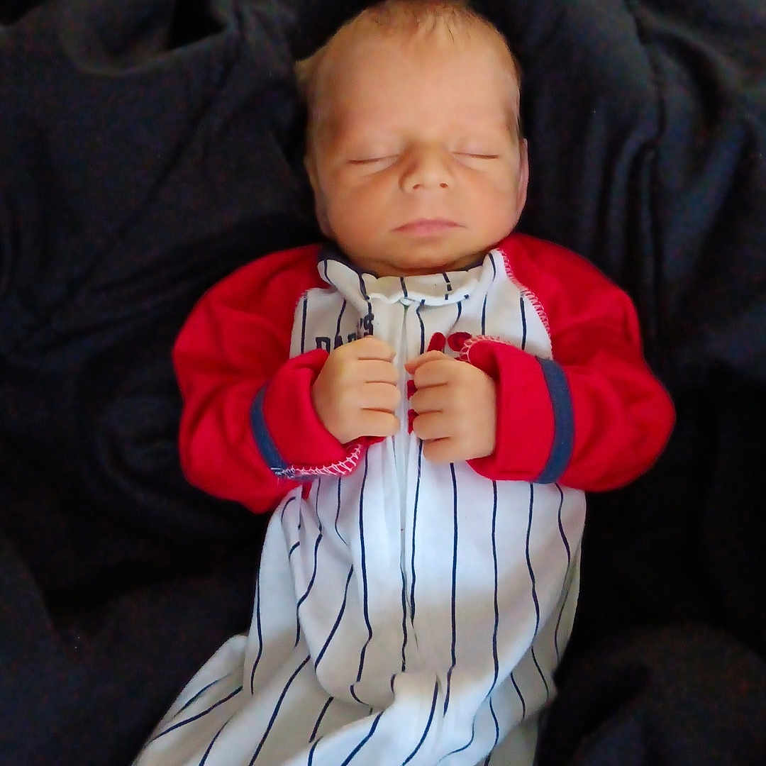 Cannon joined the competition — help win amazing prizes! baby, blanket, bodypart, clothing, couch, face, finger, furniture, glove, hand, head, knitwear, newborn, pants, people, person, photography, portrait, sleeping, sweater