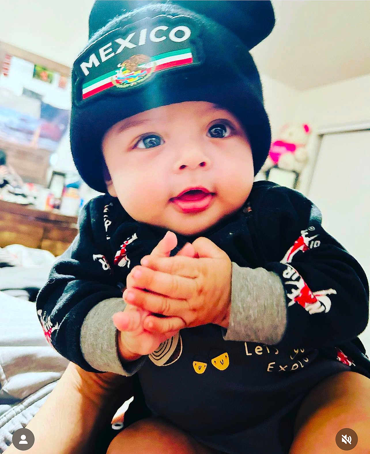 Anthony Casique is registered to the contest to win money with this photo: baby, child, infant, clothing, black_beanie, mexico, hands, face, indoor, cute, smiling, person, portrait, sitting, bright_eyes, young, warm, apparel, adorable, expression